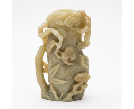 A CHINESE JADE VASE18th/19th century Carved in relief with the `Three Friends', pine, prunus and bamboo, around a tree trunk 