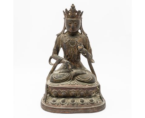 A BRONZE FIGURE OF AVALOKITESHVARAMing dynasty, 16th/17th century Seated in dhyanasana on a double lotus base, the hands held