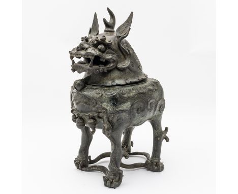 A CHINESE BRONZE LUDUAN-FORM CENSERProbably 17th century The mythical creature standing four-square on a snake which slithers