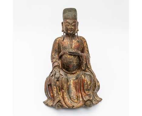 A CHINESE GILT-LACQUERED BRONZE FIGURE OF WENCHANGMing dynasty The God of Literature seated with benevolent expression, weari