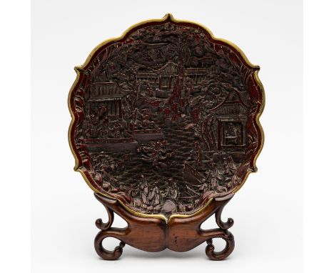 A CHINESE CINNABAR LACQUER DISH (2)Qianlong seal mark but 19th century Decorated with figures, buildings and trees on the ban