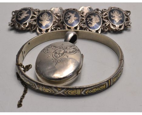 A vintage silver locket, bangle and a bracelet