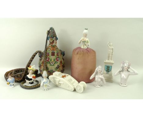 A porcelain pin cushion doll, and five further similar, a Victoria China, JR & Co mottoware 'Model of Tank' with York coat of