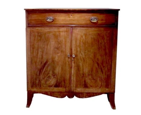 A Regency mahogany and line inlaid linen press, the single drawer above two doors with oval line inlay and brass handles, ope