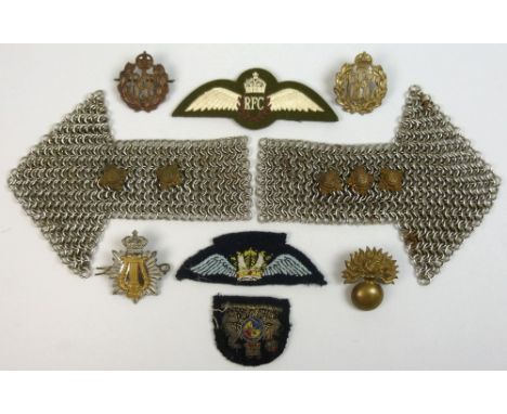 A pair of chain mail officer's epaulettes, plus collection of military badges comprising of Bath-star pips, Tria Juncta in Un