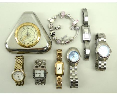 A Pandora bracelet with fourteen charms, including an enamel snowman, ying and yang enamelled ball, a dog bone dangling from 