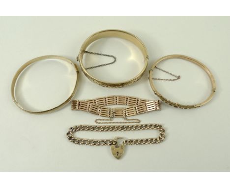 CATALOGUE AMENDMENT: REDUCTION IN GOLD WEIGHT PRESENT.A collection of gold jewellery comprising a 9ct gold five bar bracelet,