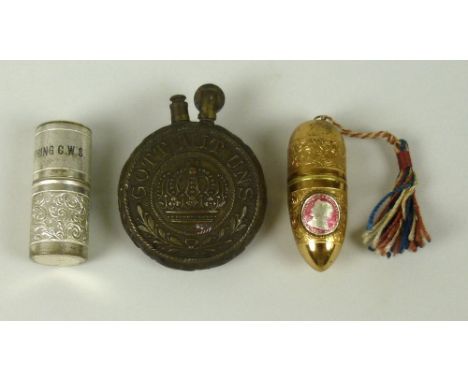 A group of WWI German trench art consisting of a brass 'Gott Mit Uns' cigarette lighter, three needle cases, 'Crumpsall Cream