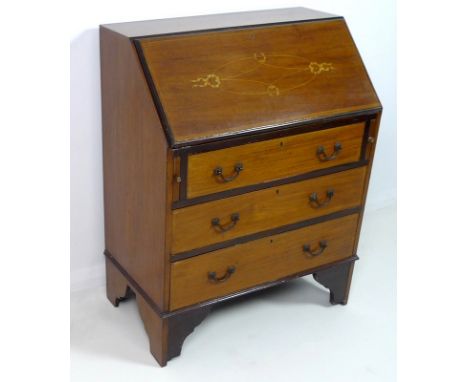 An Edwardian mahogany bureau, with inlaid decoration to the fall front, fitted interior, over three drawers, raised on bracke