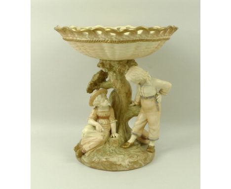 A Royal Worcester blush ivory porcelain centre piece, circa 1891, the basket weave top, above naturalistic pedestal with figu