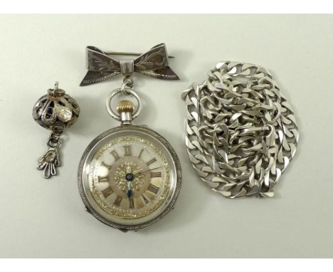 A silver lady's pocket watch, the dial with Roman numerals and floral spandrels, with ribbon shaped brooch to top, a silver f