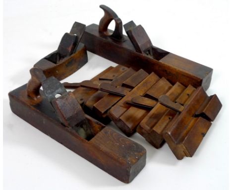 A collection of early to mid 20th century woodworking tools, comprising five moulding planes and three wood planes, some with