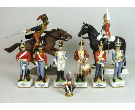 A group of military ceramics comprising a Goebel figure 'Trooper of the Life Guards in Mounted Review Order', 32cm tall by 26