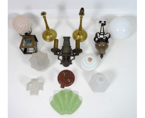 A Bakelite adjustable wall light, 1930s, two table lights, four 1930-1950s glass lamp shades, brass porch lantern, wrought ir