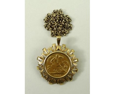 An Edward VIII gold half sovereign, 1902, in a 9ct gold decorative mount and chain, 14.9g total weight. 