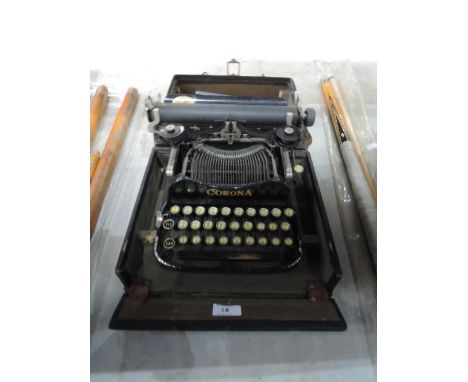 A vintage Corona fold over boxed typewriter with instruction book