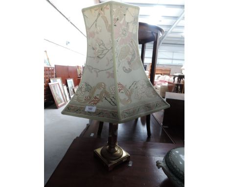 A brass table lamp (wiring removed)
