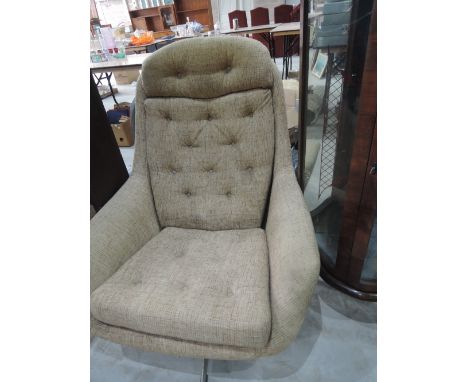 A vintage 1970s style designer swivel chair (sold as collectors item)