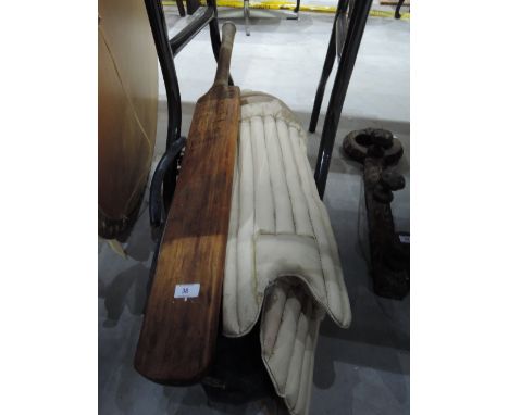 A bag of cricket equipment including a vintage Wellington The Peter May Autograph bat