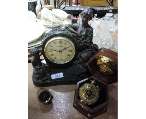 A resin mantle clock, a boxed compass and small brass clock