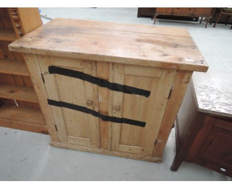 A vintage pine side cabinet