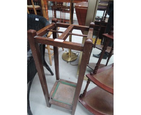 An early 20th Century oak framed stick/umbrella stand