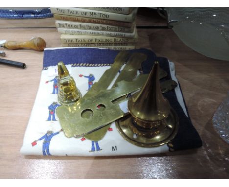 A selection of brassware including button polisher and spike from German helmet and a tea towel depicting semaphore