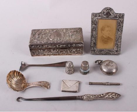 A Georgian design silver shell-bowl caddy spoon, a silver sovereign case, a silver envelope stamp case and various other silv