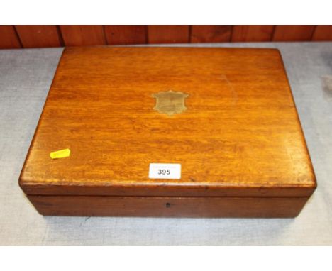 An oak box containing a selection of modern ladies and gentlemen's wristwatches, spares, etc and a small selection of watch m