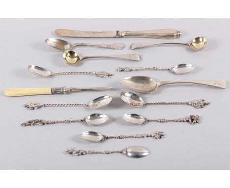 A pair of Victorian silver mustard spoons, a Georgian silver teaspoon, a number of Eastern white metal teaspoons, a silver lo