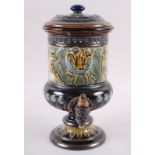A Doulton Lambeth water filter with relief cherub decoration, 13" high (chipped)