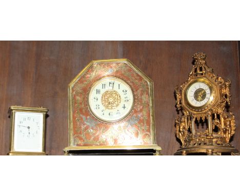An early 20th century copper and brass cased mantel clock, decorated birds and ribbons with white enamel dial (cracked) and A