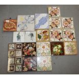 An 18th century Delft blue and white floral decorated tile, an Intarsia tile and a quantity of other