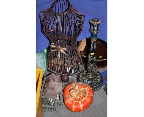A miniature wirework mannequin, a turned wood and painted candelabrum, a miniature bird cage and a dried pumpkin 