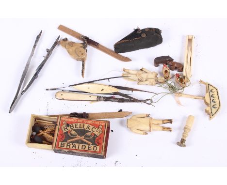 An ivory and brass seal, an ivory cotton winder, two miniature Black Forrest bears, a pair of miniature skis and other decora