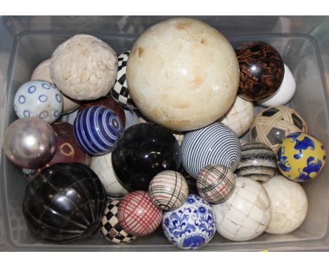 A quantity of china spheres, various, including three Victorian carpet balls 