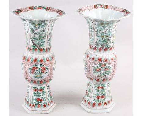 A pair of Chinese 18th century design gu vases, decorated floral reserves, 12 1/4" high (damages) Condition: Bases have numer