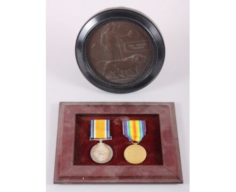 A WWI British Service and Defence medal, in frame, and a death plaqueOn both medals: 2 . Lieut . G . R . WillansName on death