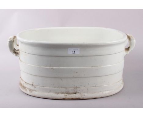A 19th century white glazed two-handled basin 