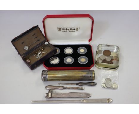 A Sampson Mordan silver mounted cigar cutter, a silver mounted toothbrush box, button hook, a small number of silver and othe