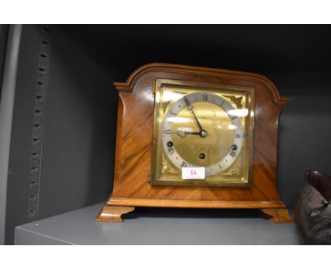 A fine mantle clock having wooden case with ormolu face by Elliott Reid