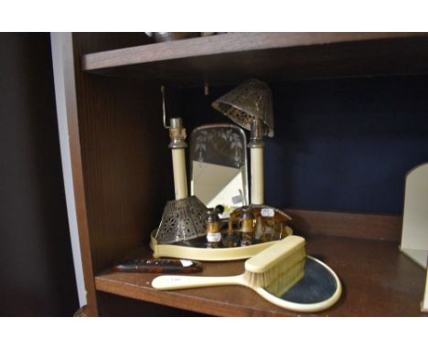 A selection of vintage bone or similar dressing table items including mirrors, an early 20th century air comb,inlaid glasses 