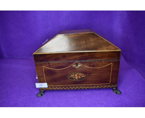 A fine Edwardian casket form tea caddy having mahogany and inlayed case