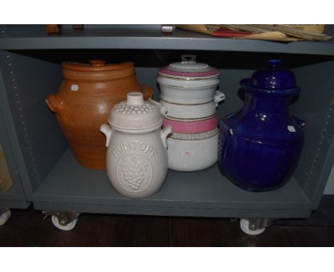 A selection of large ceramic buscuit jar and similar grain and flour containers