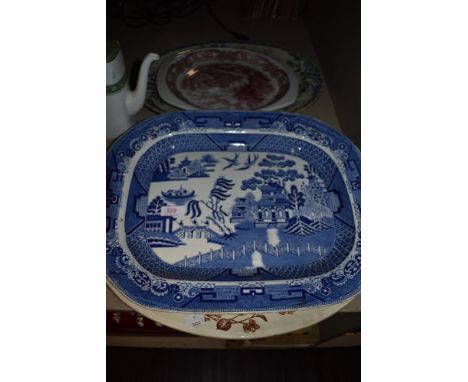 Four large ceramic charger plates inclduing Willow wear