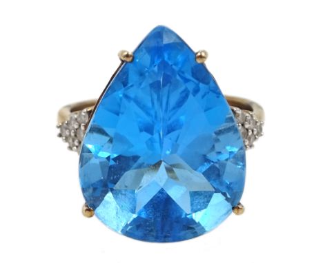 9ct gold pear shaped blue topaz ring, with diamond set shoulders, hallmarked - Condition Report Approx 6.1gm, size R-S, topaz