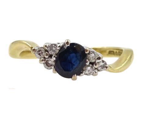 18ct gold oval sapphire and six stone diamond ring, hallmarked  - Condition Report Approx 3.2gm, size K-L, head length = 12mm