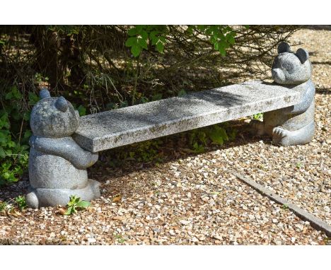 A sculpted granite garden bench, late 20th century, the rectangular seat supported by a carved model of a seated panda at eac