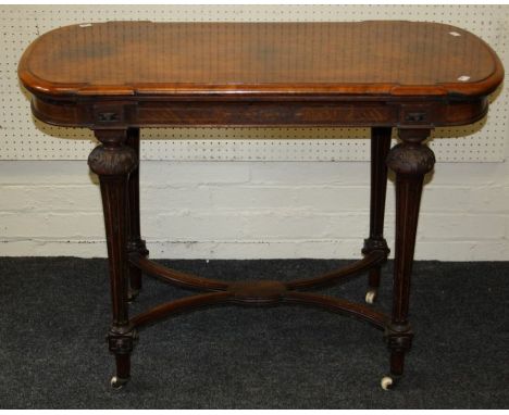 A Victorian burr walnut, boxwood strung card table, the breakfront D end rectangular folding swivel top, beize lined on flora