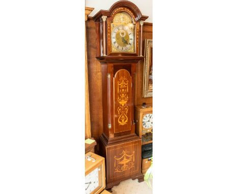 A late Victorian or early Edwardian longcase clock with three-train movement chiming on tubes. Strike silent and chime silent